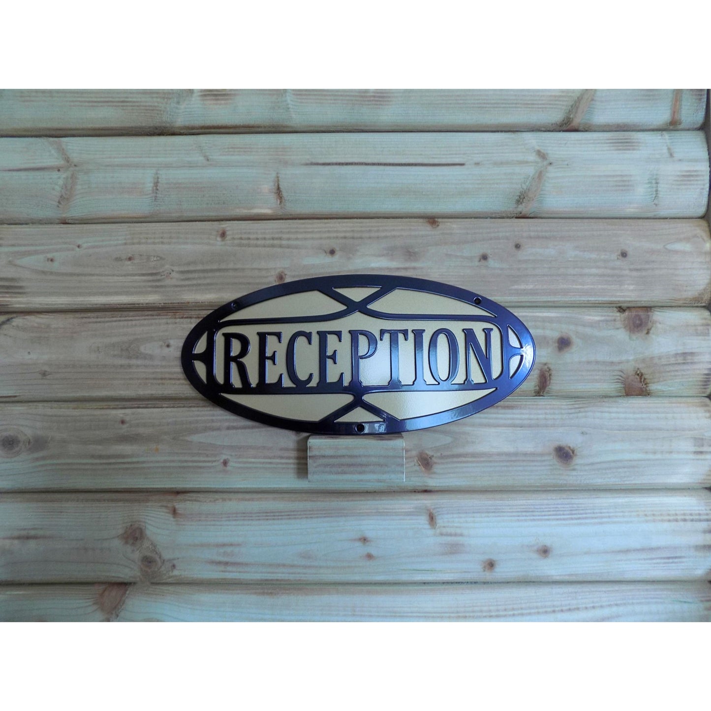 black metal reception sign with gold backing plate