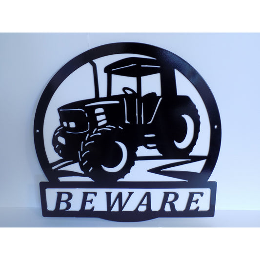 Round black metal “BEWARE” tractor sign on a plain white background, designed for farm or machinery safety.