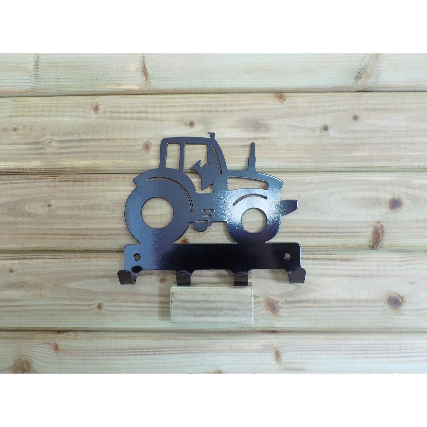 Children’s tractor wall hook in black powder-coated metal with four hooks, handmade in Ireland