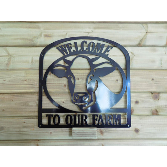 Welcome to Our Farm sign with dairy cow silhouette in black steel
