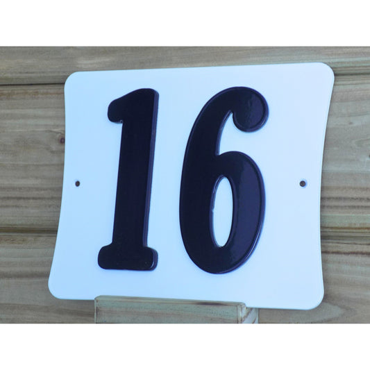 white metal house number plaque black numbers close up made in ireland
