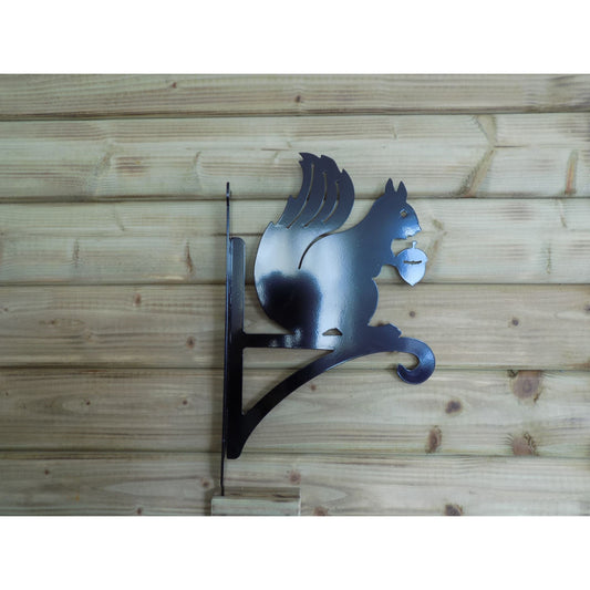 black metal squirrel holding acorn wall hanger for flower baskets made in ireland