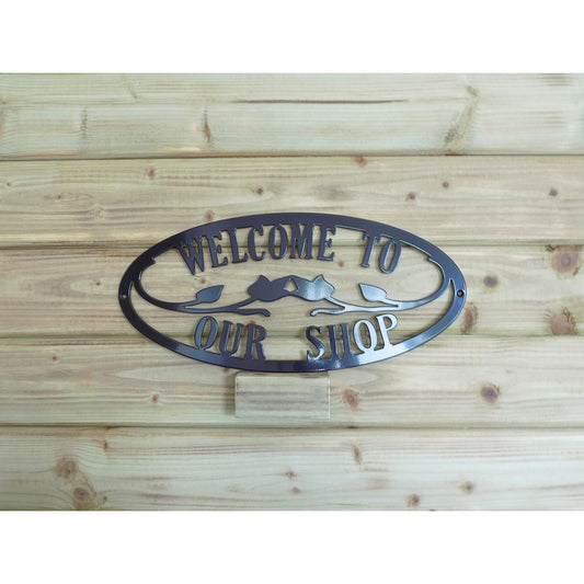 black oval metal wall sign welcome to our shop made in ireland