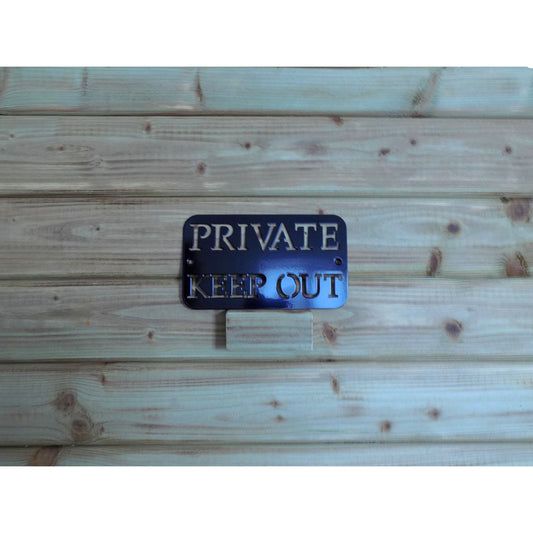 Black steel private keep out metal sign displayed on a wooden background with optional backing plate available