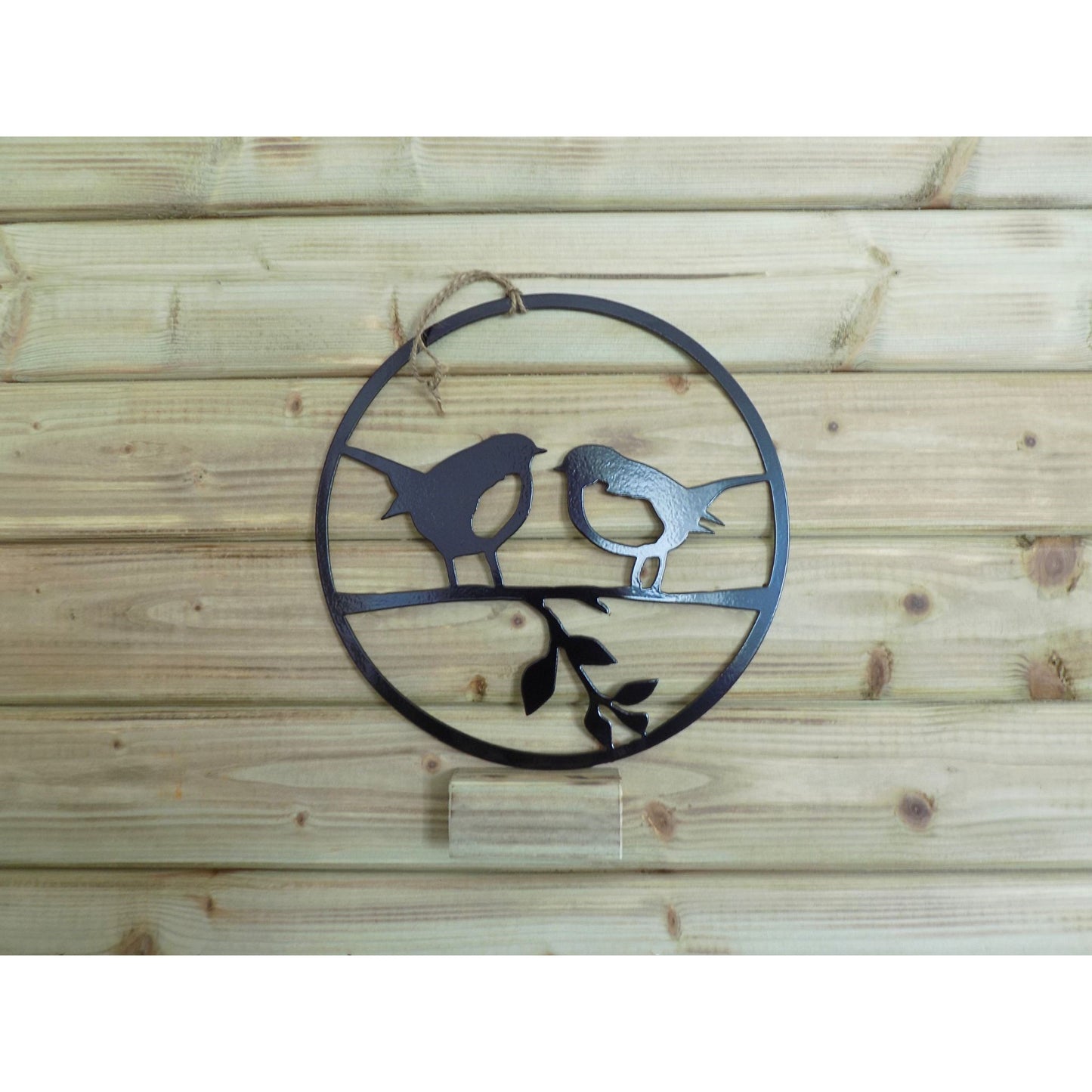 Round metal robin wall art with two robins on a branch, handmade in Ireland, available in black finish