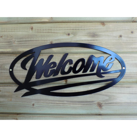 Black oval metal “Welcome” sign mounted on wooden wall, powder-coated and handmade in Ireland for home or business use