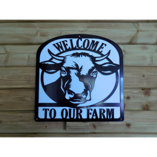 Welcome to Our Farm black metal sign with cow silhouette design and white backing plate